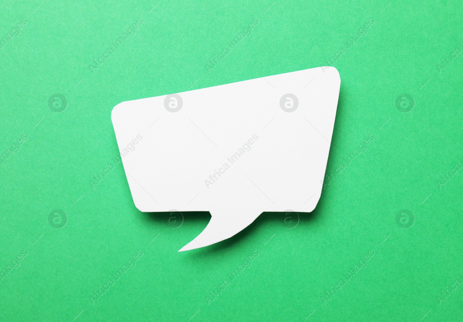 Photo of Blank speech bubble on green background. Space for text