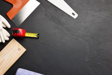 Photo of Different construction materials and tools on grey table, flat lay. Space for text