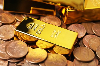 Photo of Gold bars on coins as background, closeup