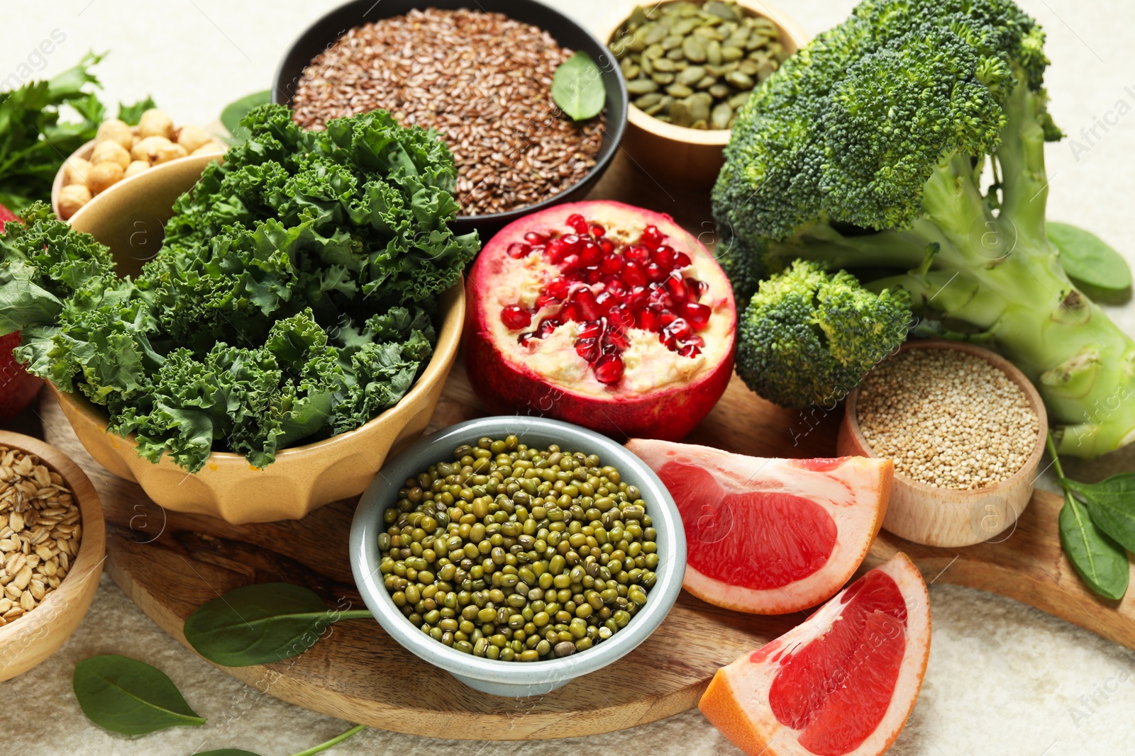 Photo of Different superfood products on light table, closeup