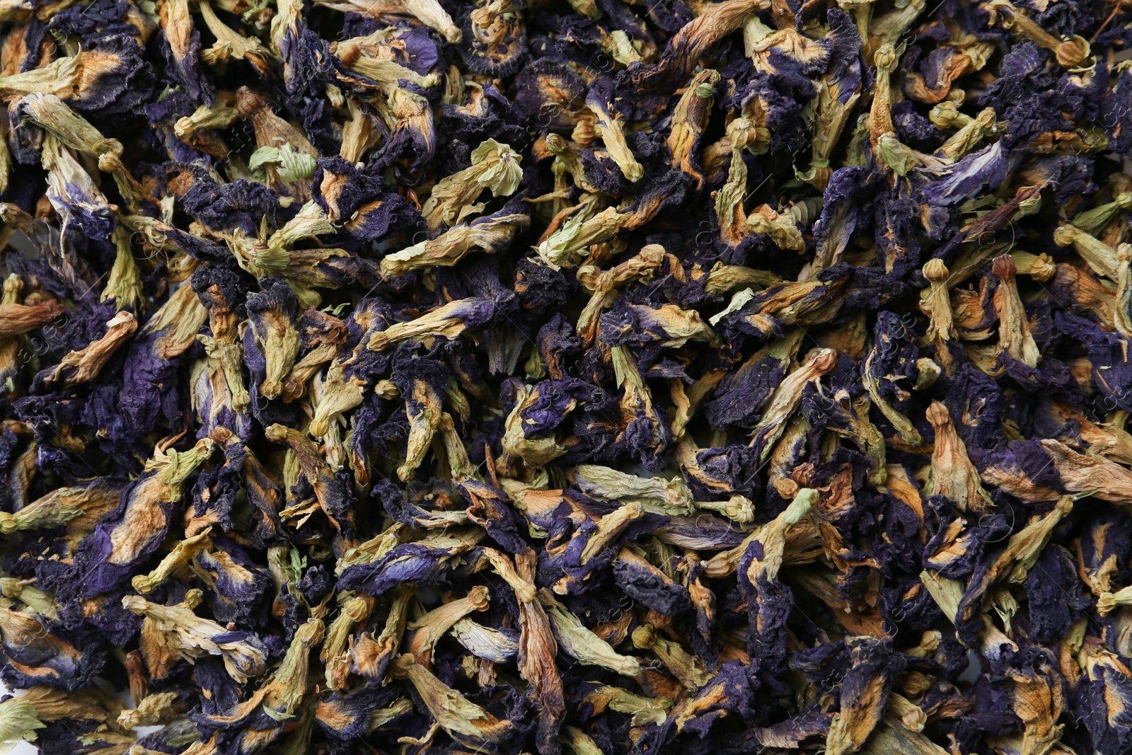 Photo of Butterfly pea flower tea as background, closeup