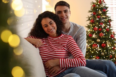 Photo of Happy couple spending time together at home. Christmas celebration