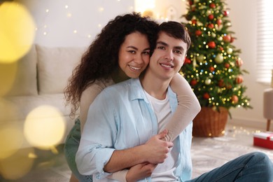 Photo of Happy couple spending time together at home. Christmas celebration