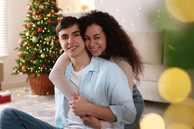 Photo of Happy couple spending time together at home. Christmas celebration