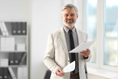 Photo of Banker with documents in office, space for text