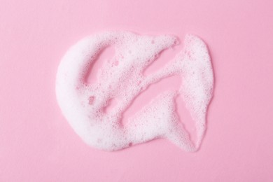 Photo of Sample of fluffy foam on pink background, top view