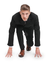 Photo of Businessman in starting position for run ready for competition on white background