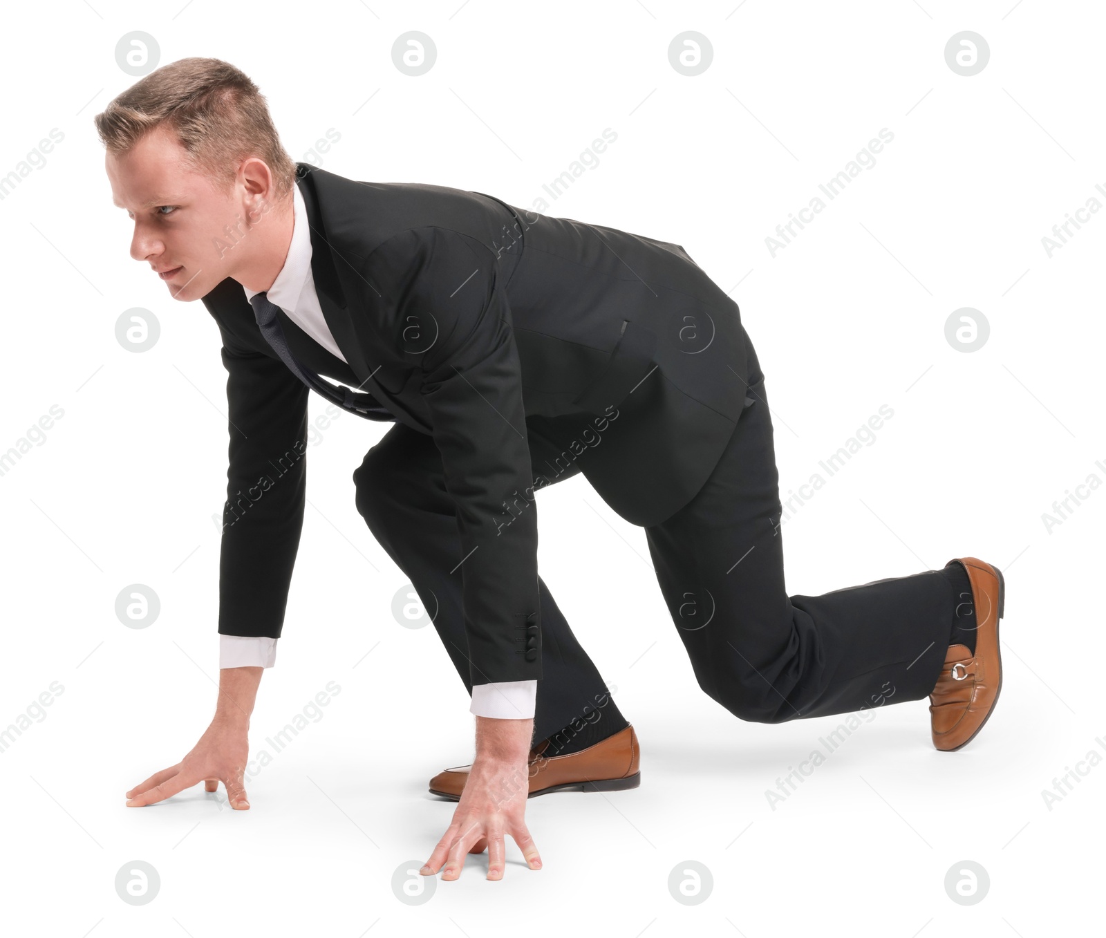 Photo of Businessman in starting position for run ready for competition on white background