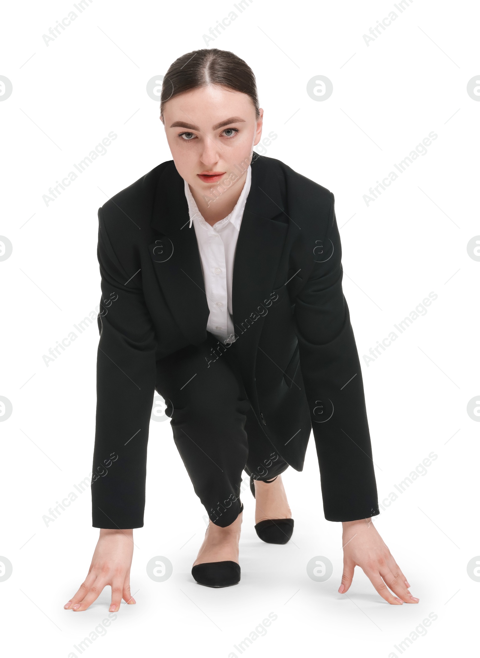 Photo of Businesswoman in starting position for run ready for competition on white background