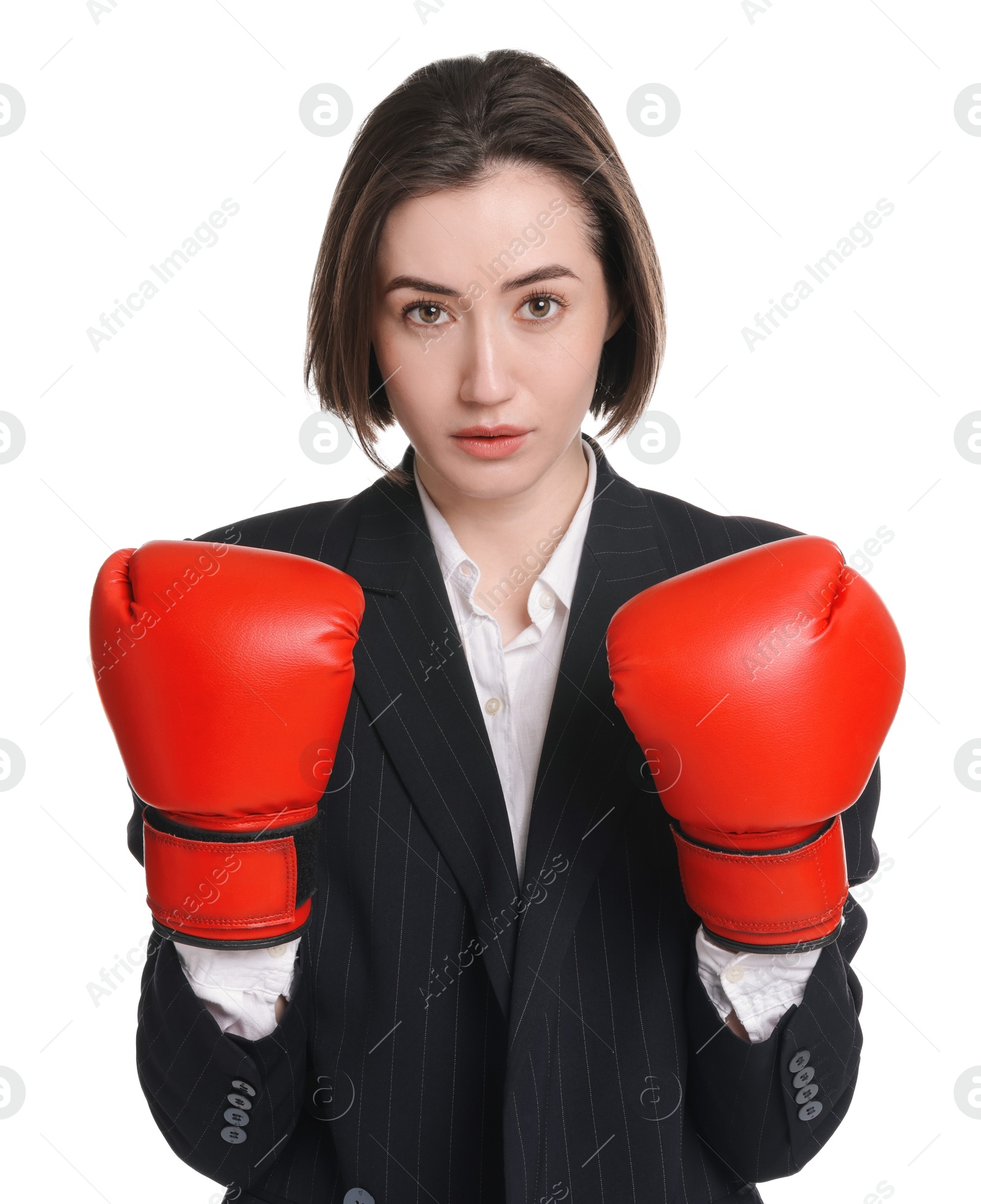 Photo of Competition. Businesswoman in suit wearing boxing gloves on white background