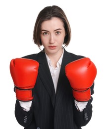 Photo of Competition. Businesswoman in suit wearing boxing gloves on white background