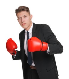 Photo of Competition. Businessman in suit wearing boxing gloves on white background