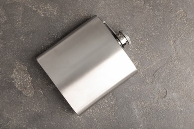 Photo of One hip flask on grey table, top view