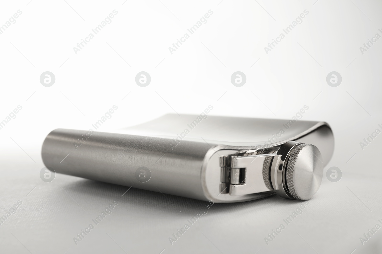 Photo of One hip flask on light table, closeup