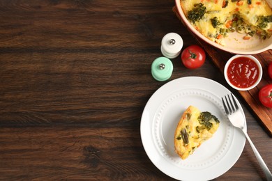 Photo of Tasty vegetable casserole served with sauce and spices on wooden table, flat lay. Space for text