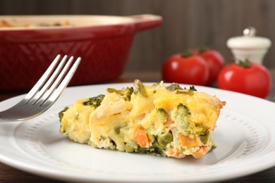 Photo of Piece of tasty vegetable casserole on table, closeup