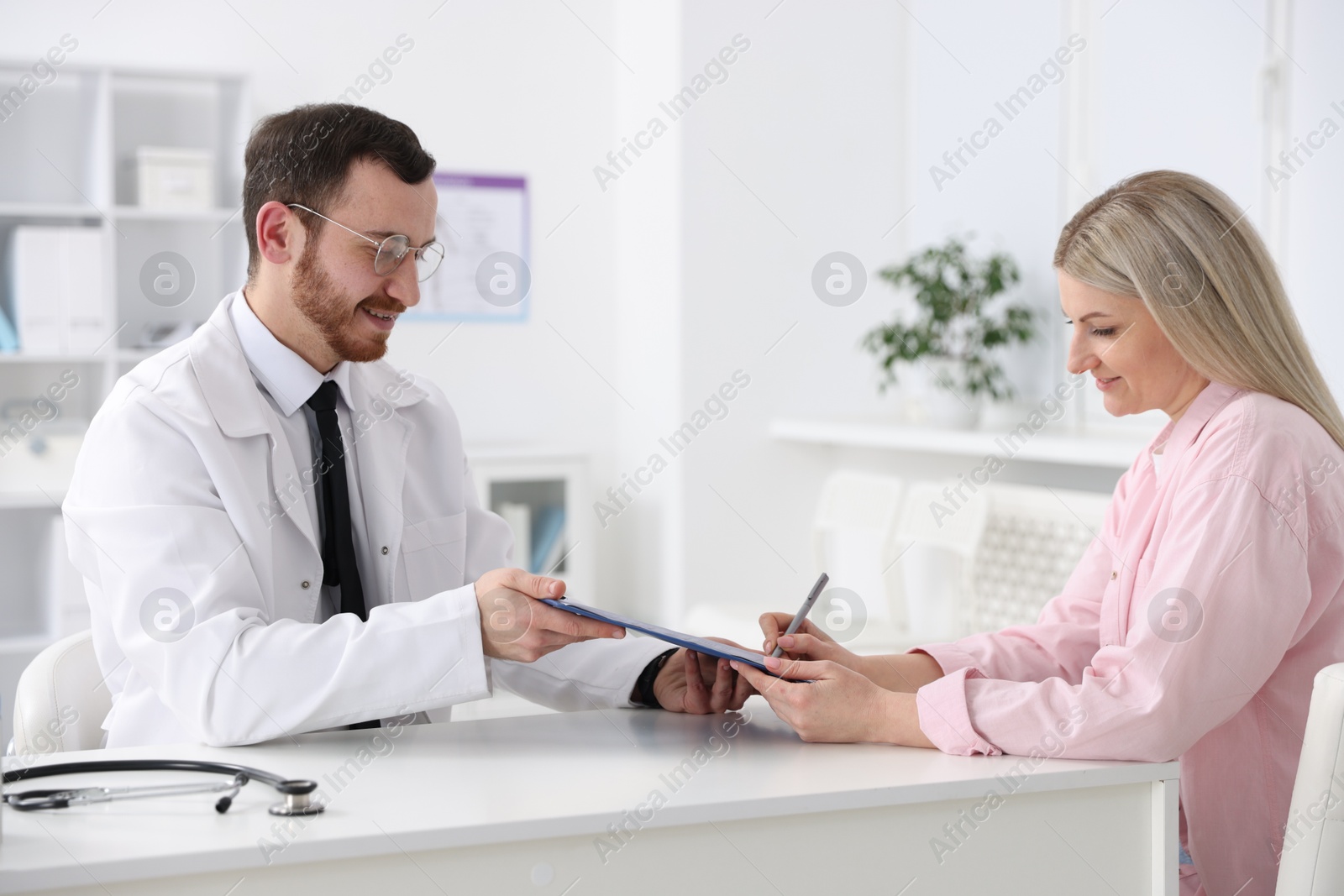 Photo of Woman having appointment with doctor in hospital