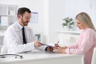 Photo of Woman having appointment with doctor in hospital