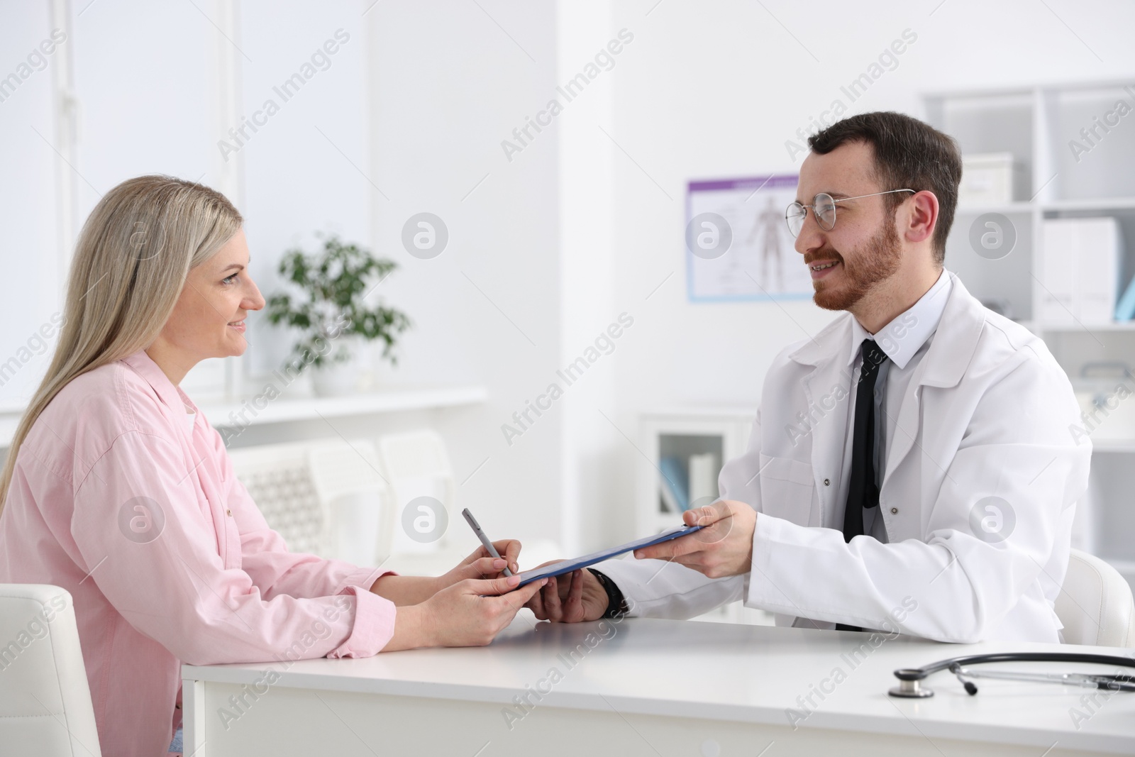 Photo of Woman having appointment with doctor in hospital