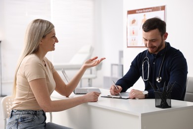 Photo of Woman having appointment with doctor in hospital