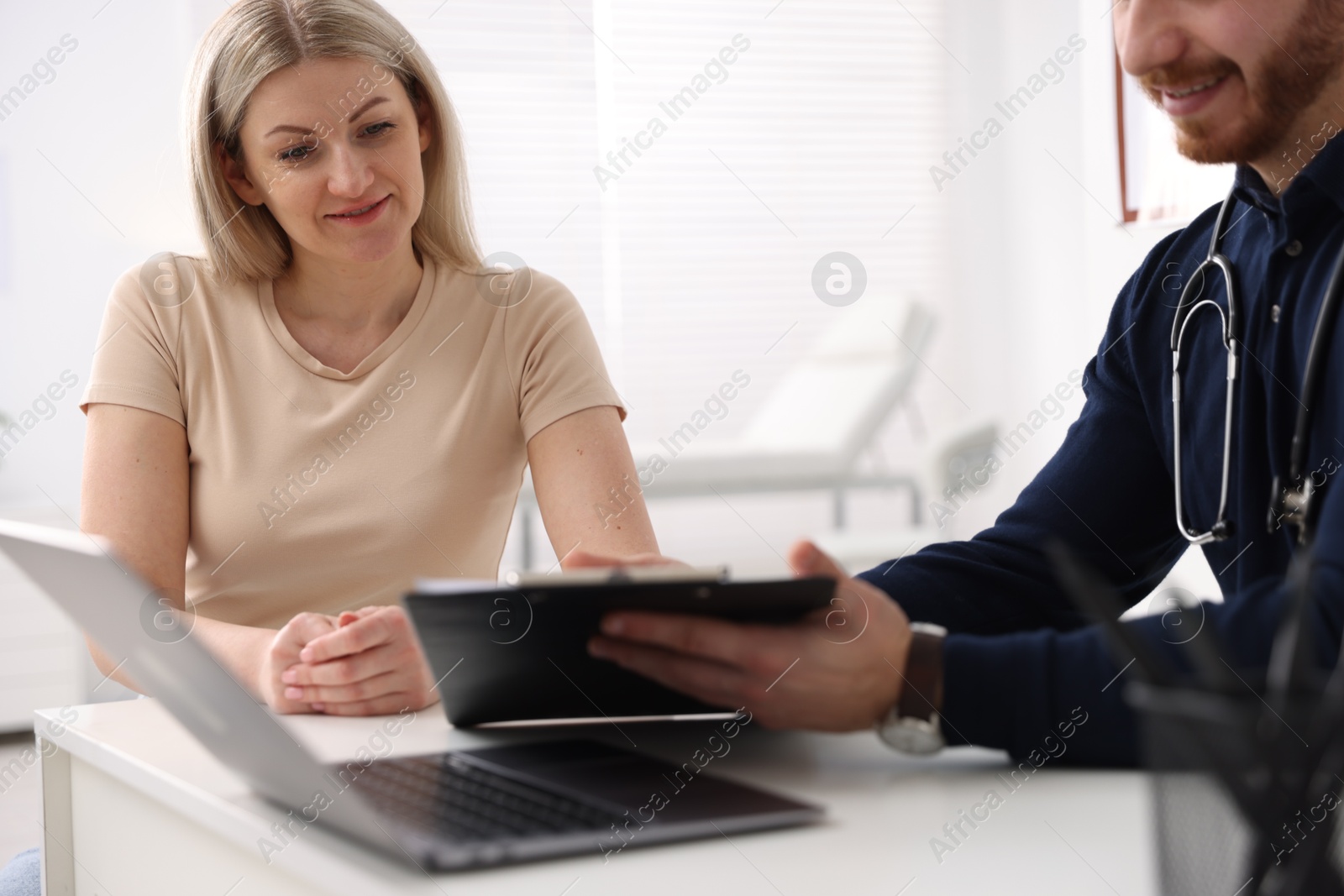 Photo of Woman having appointment with doctor in hospital