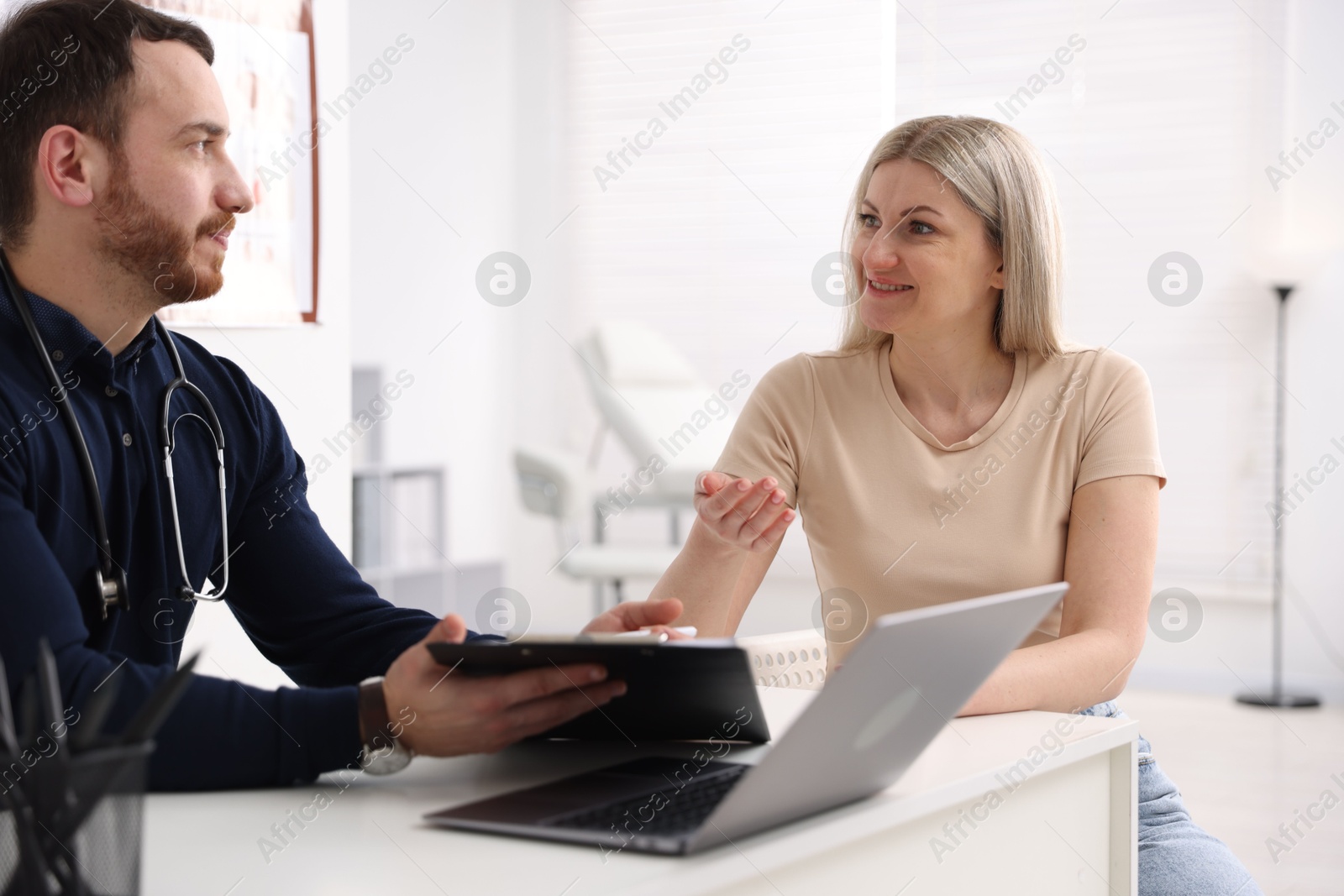 Photo of Woman having appointment with doctor in hospital