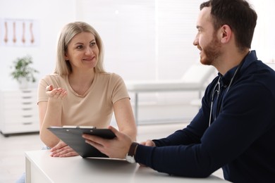 Photo of Woman having appointment with doctor in hospital