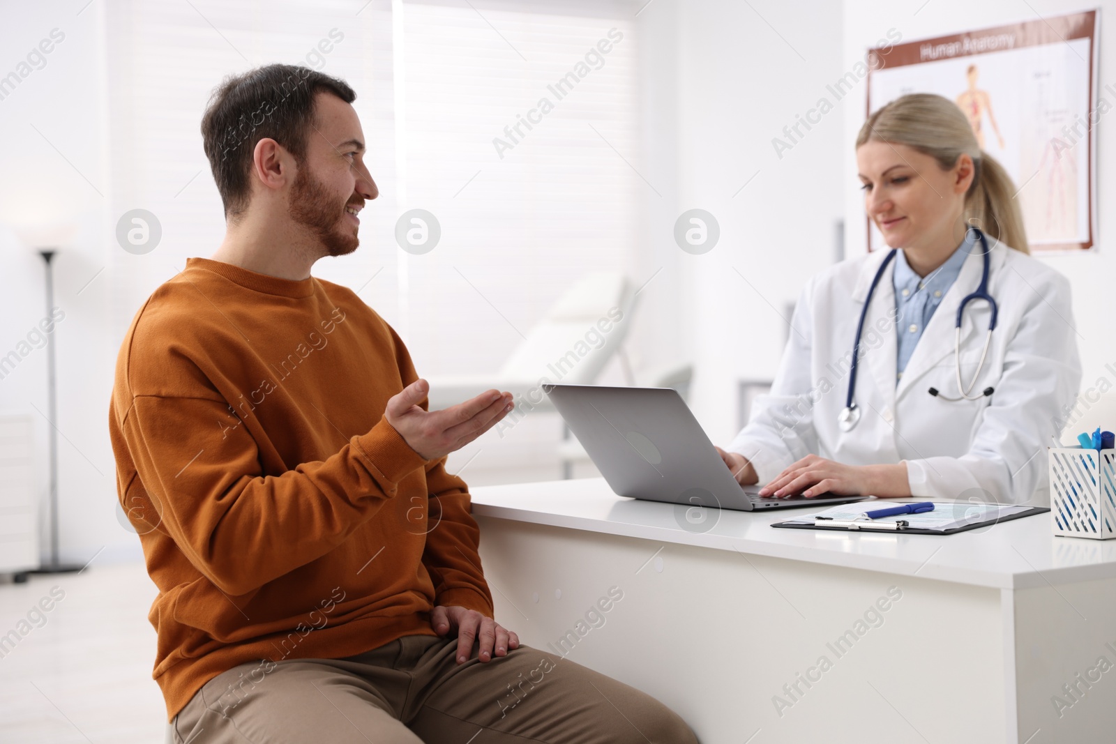 Photo of Man having appointment with doctor in hospital