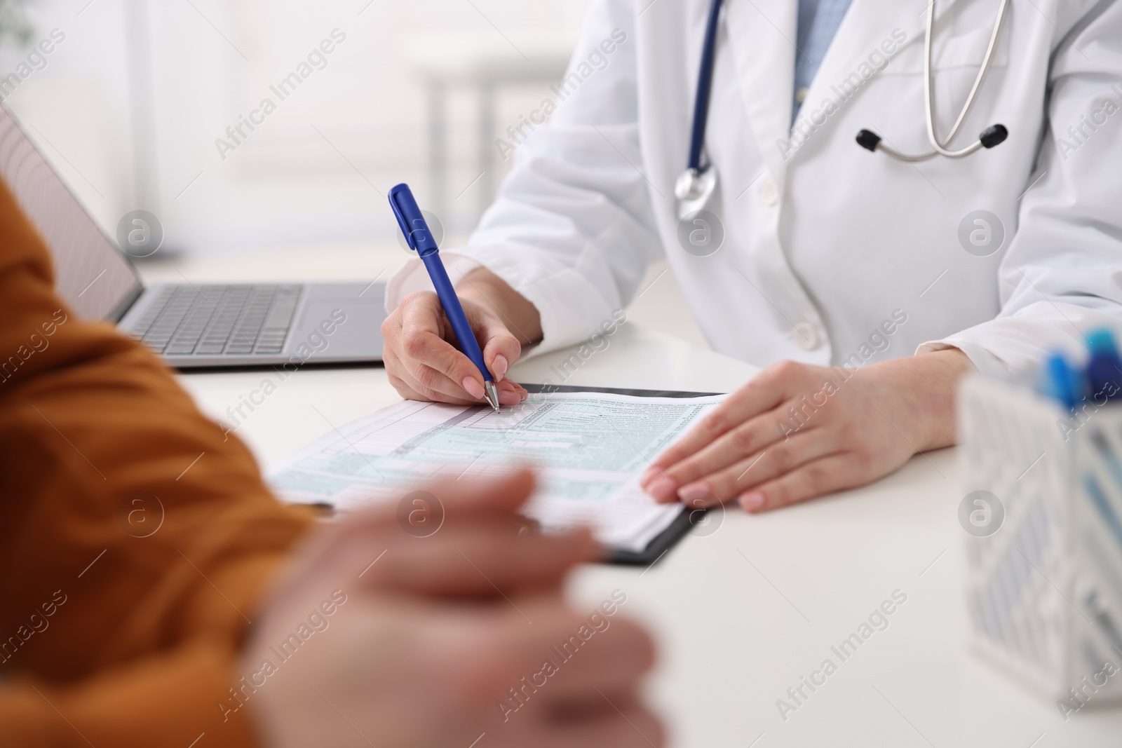 Photo of Man having appointment with doctor in hospital, closeup