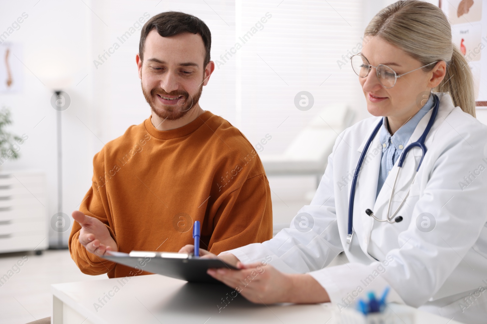 Photo of Man having appointment with doctor in hospital