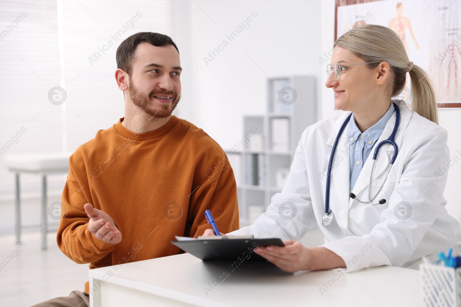 Photo of Man having appointment with doctor in hospital