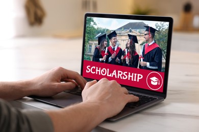 Image of Student searching for scholarships using laptop at home, closeup. Open website on device screen