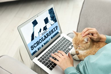 Image of Student searching for scholarships using laptop at home, closeup. Open website on device screen