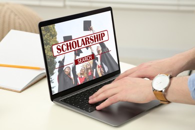 Image of Student searching for scholarships using laptop at home, closeup. Open website on device screen