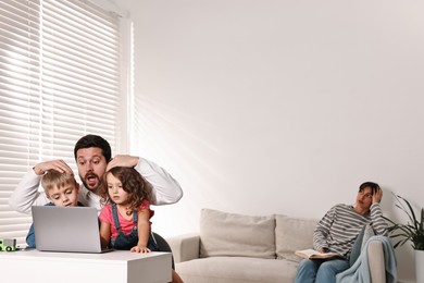 Photo of Father with children using laptop while their overwhelmed mother on sofa at home. Space for text