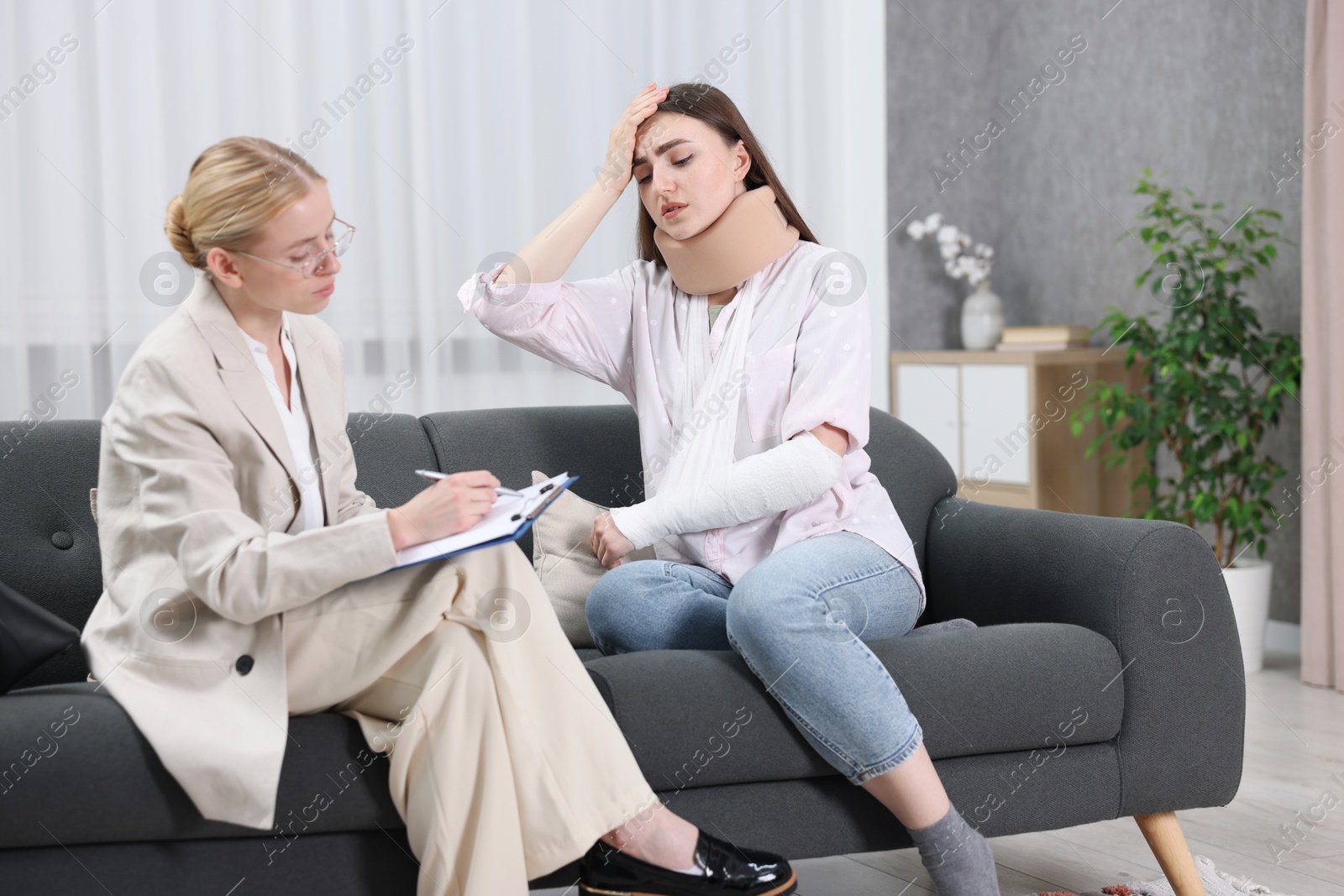 Photo of Injured woman having meeting with lawyer in office