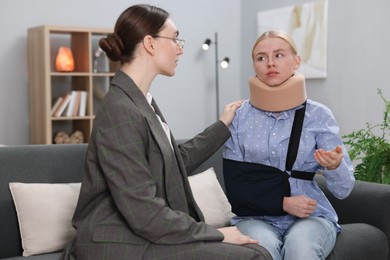 Photo of Injured woman having meeting with lawyer in office