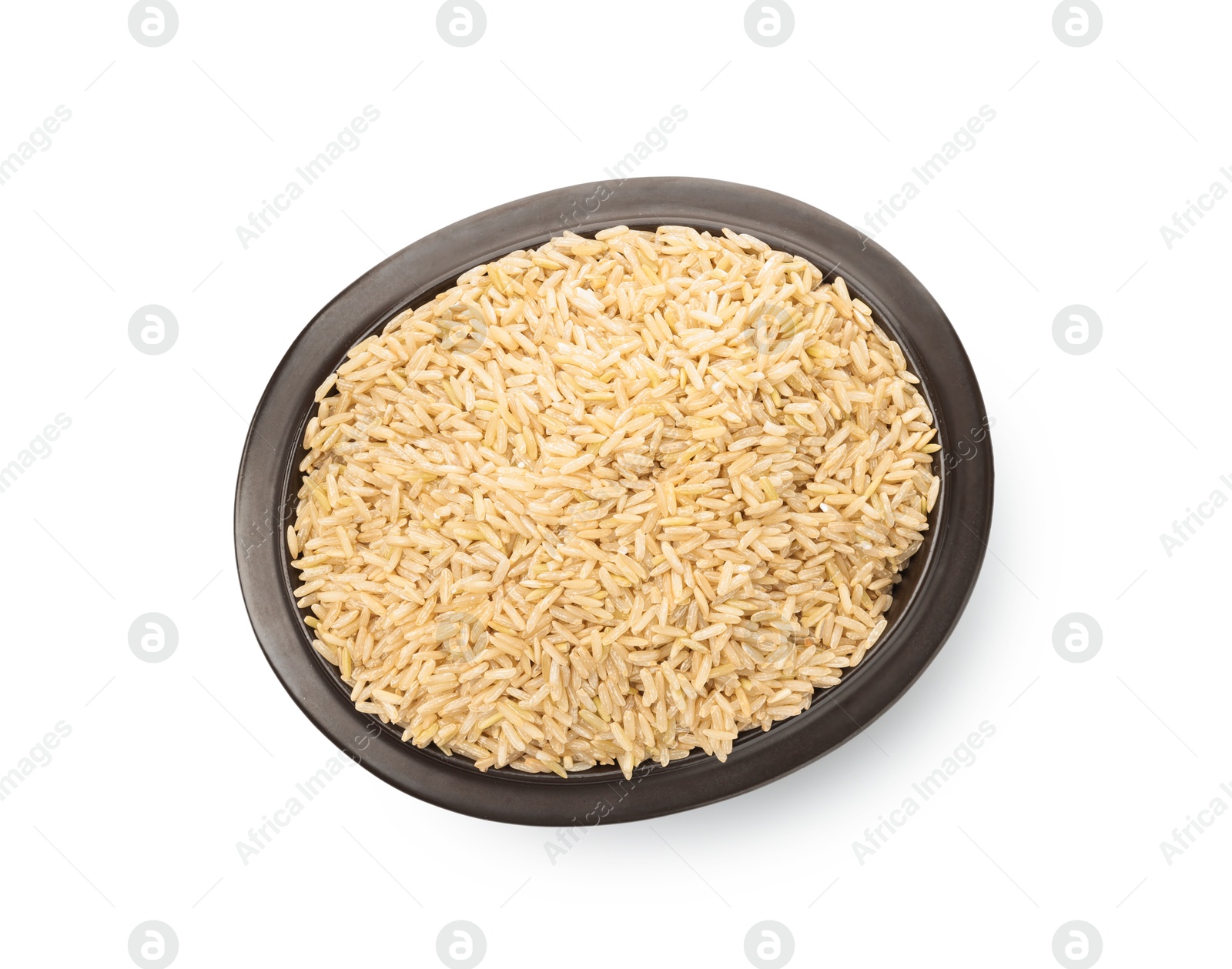 Photo of Raw brown rice in bowl isolated on white, top view