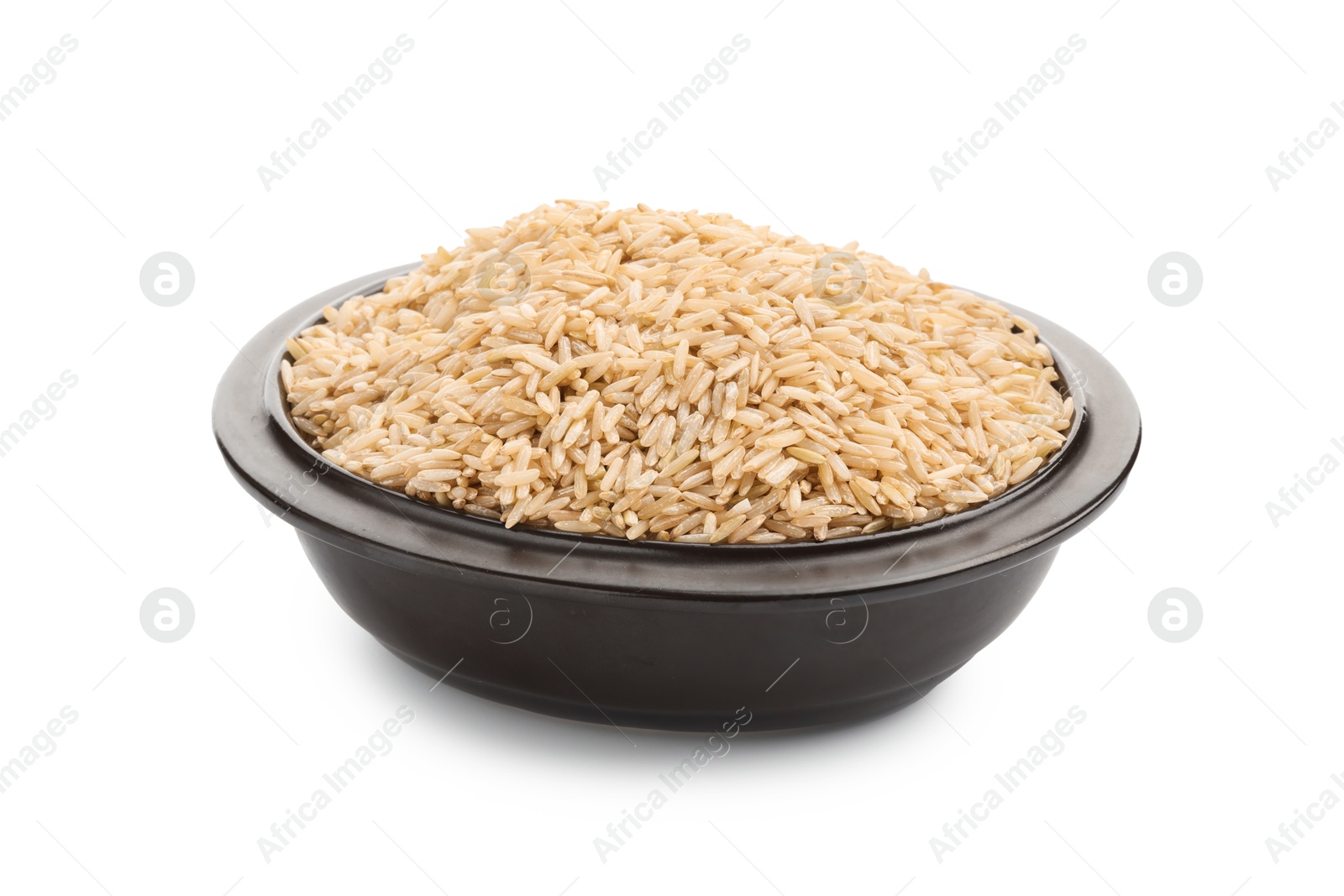 Photo of Raw brown rice in bowl isolated on white