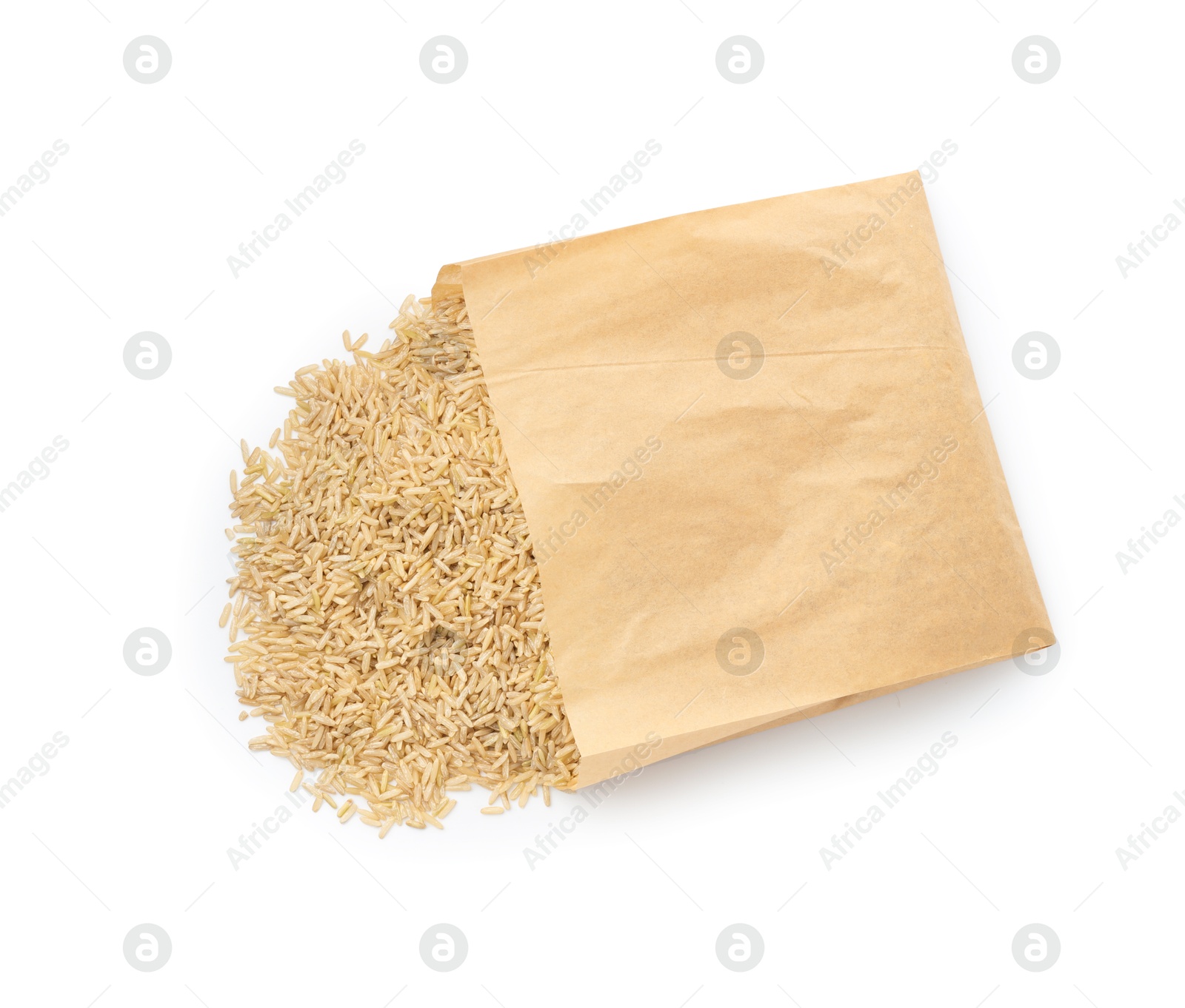 Photo of Raw brown rice in paper bag isolated on white, top view