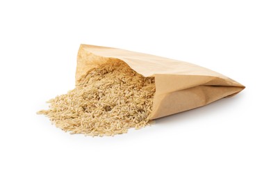 Photo of Raw brown rice in paper bag isolated on white