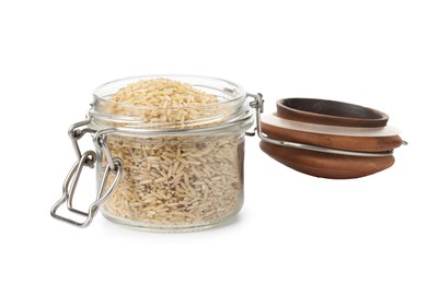 Photo of Raw brown rice in open jar isolated on white