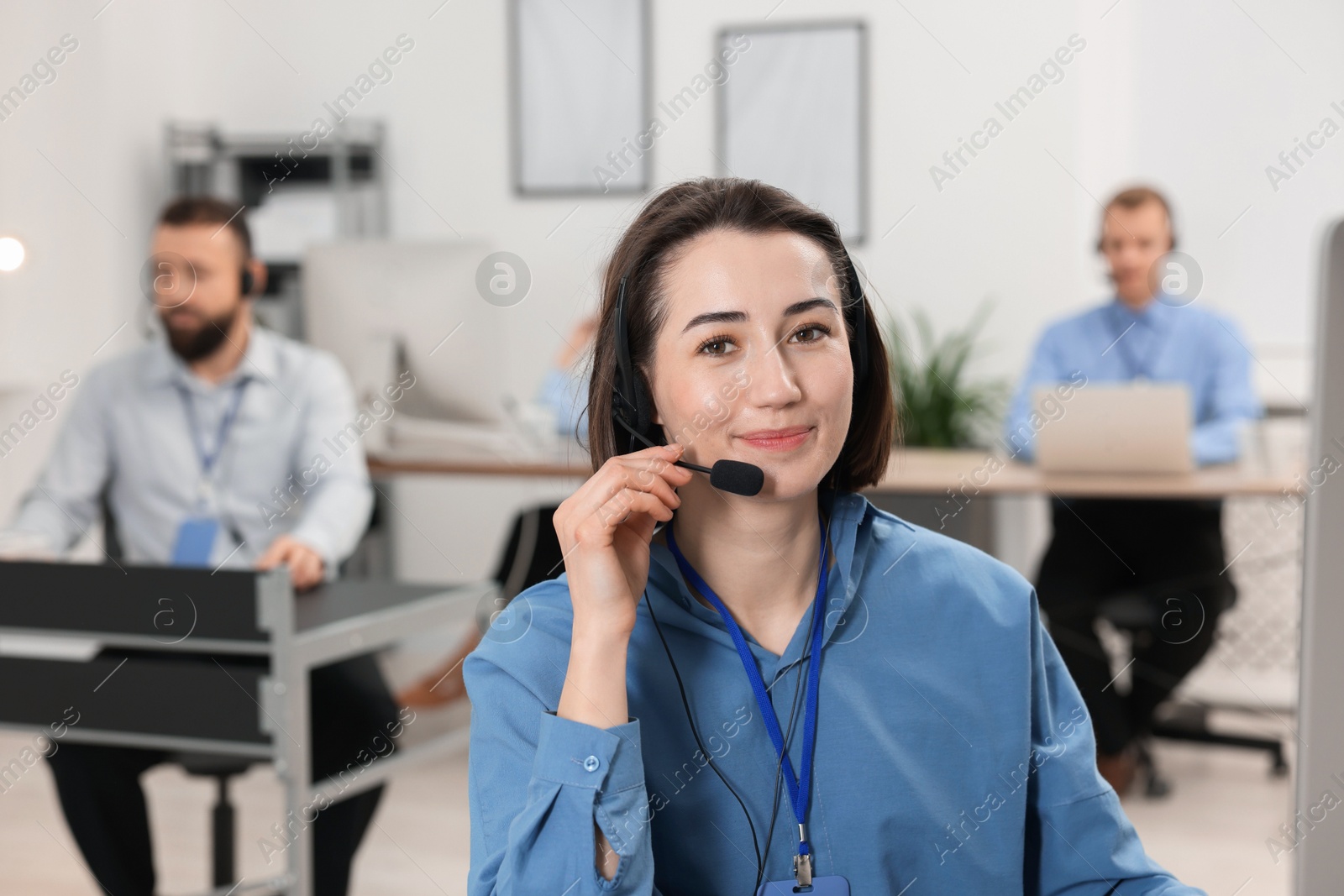 Photo of Technical support call center. Operator working in office