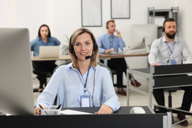 Technical support call center. Team of operators working in office