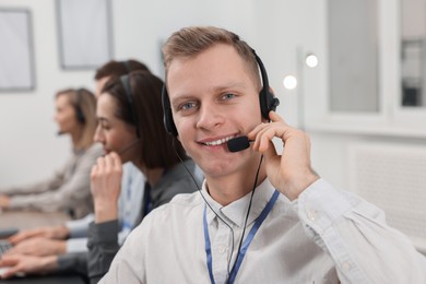 Technical support call center. Team of operators working in office