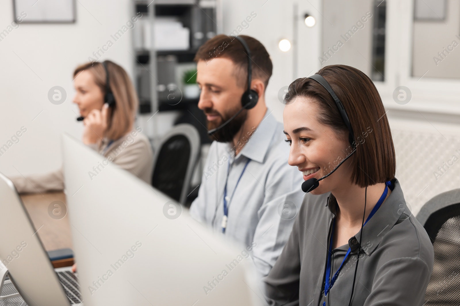 Photo of Technical support call center. Team of operators working in office