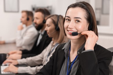 Technical support call center. Team of operators working in office