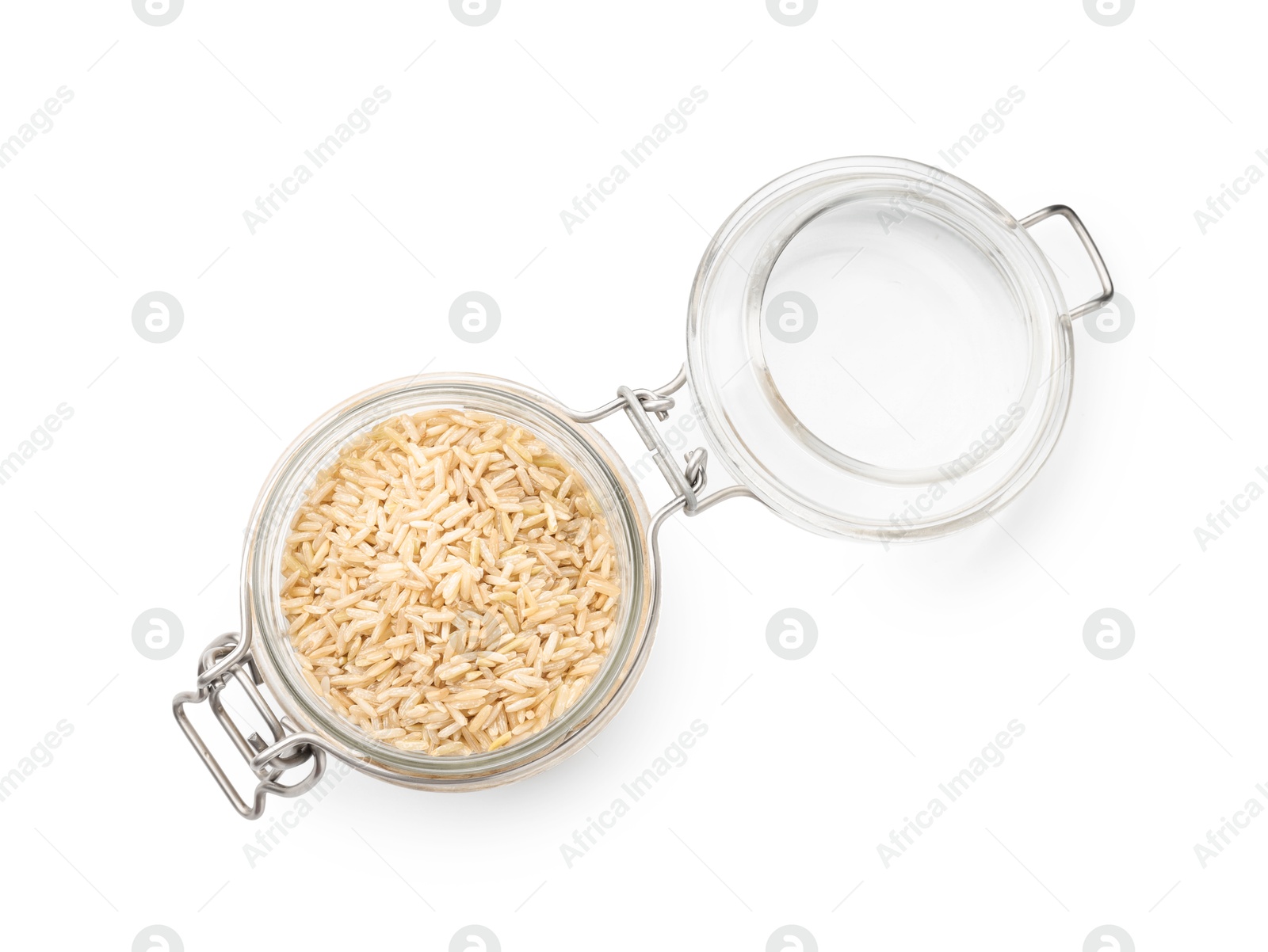 Photo of Raw brown rice in open jar isolated on white, top view