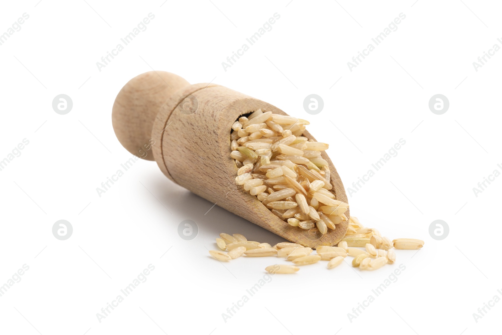 Photo of Raw brown rice and scoop isolated on white