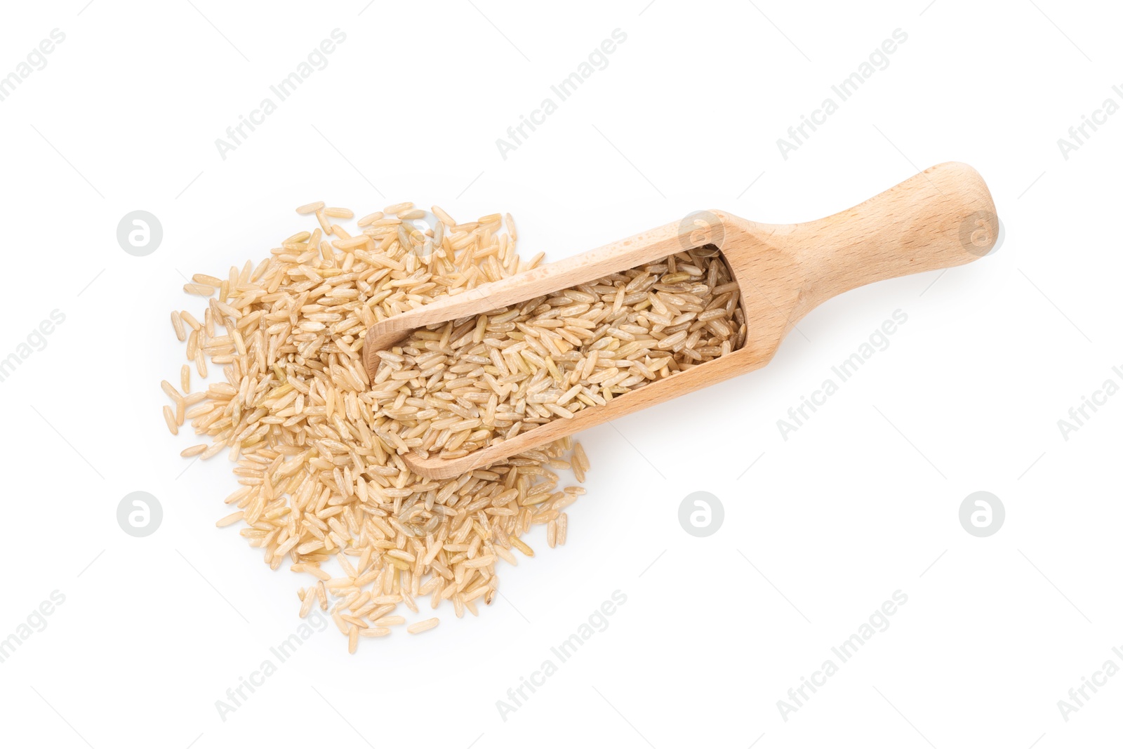 Photo of Raw brown rice and scoop isolated on white, top view